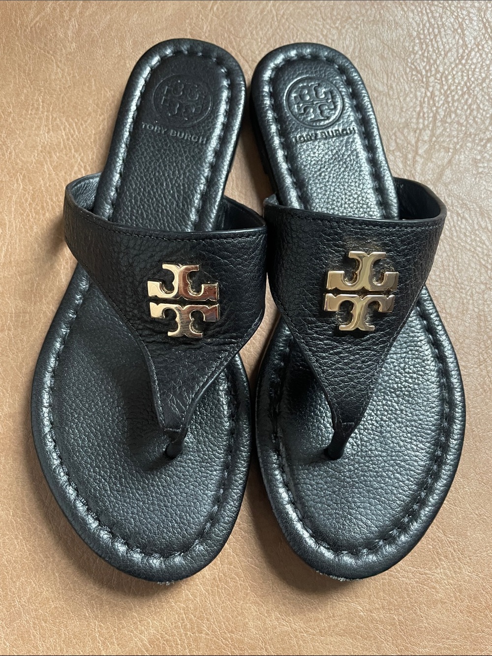 Tory Burch Black soft Leather Thong flip flop with Gold Logo Accent.